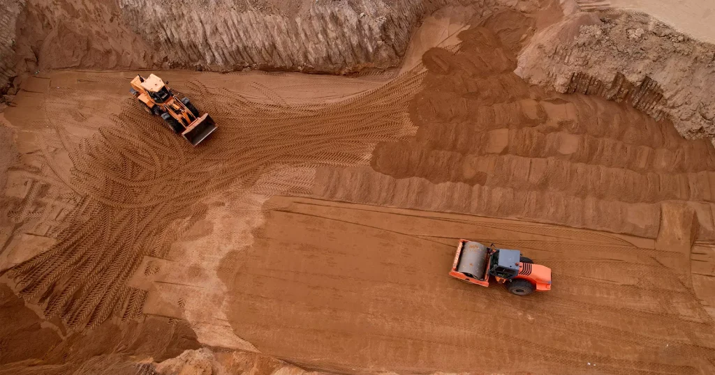 Excavated red earth on an earthworks site