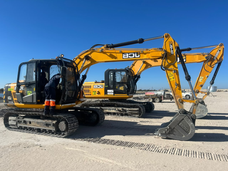 Excavator loading material on a construction site
