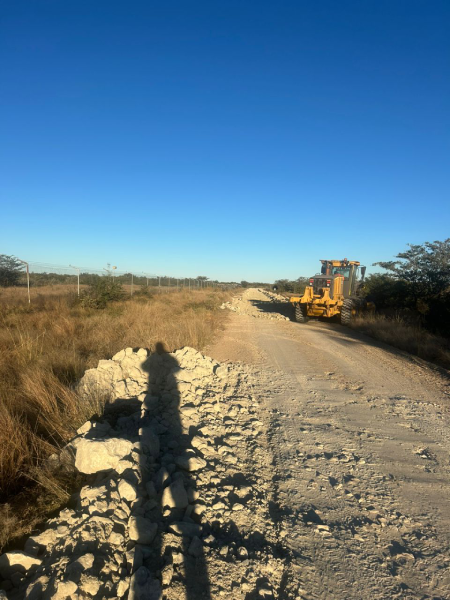 Motor grader working on a gravel road
