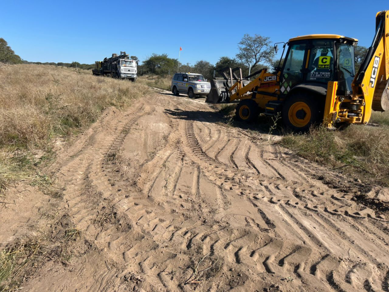 Vehicles and plant on a sandy work site