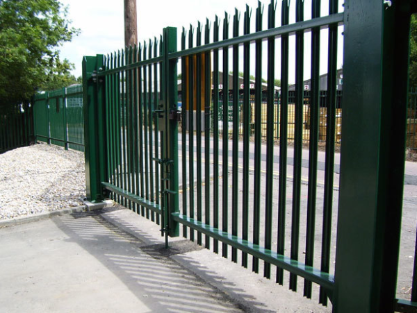 Green palisade fence and gate