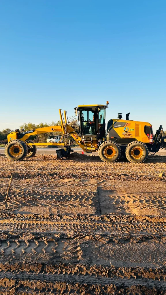 Motor grader shaping a gravel road