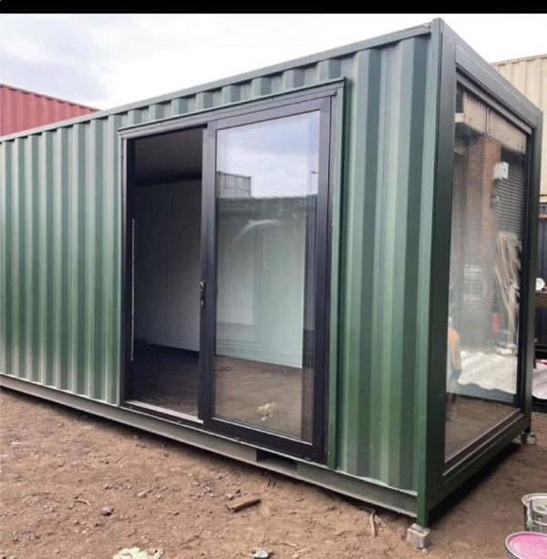 Steel door and window openings fitted to a modified container